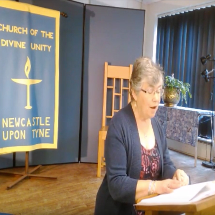 Elizabeth Faiers leading worship in the downstairs Turner Hall at Newcastle upon Tyne Unitarians.